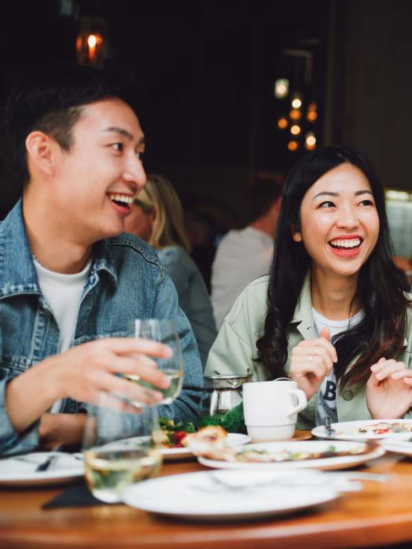 Residents having a cheers with colorful drinks near Camino at BuHi in Doraville, Georgia