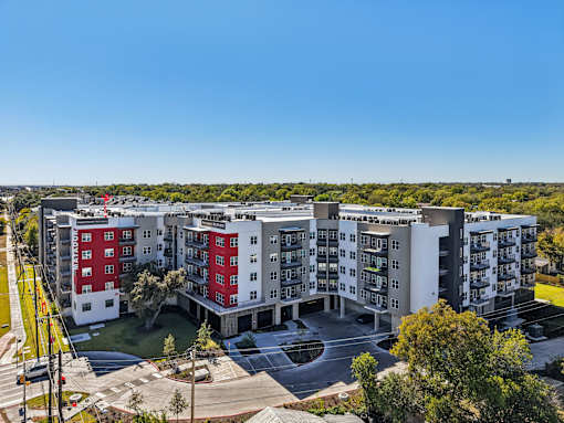 Modern apartment community aerial view with courtyards at Matador Apartments, Austin