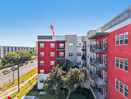 Aerial view of colorful apartment building with courtyard at Matador Apartments, Texas, 78745