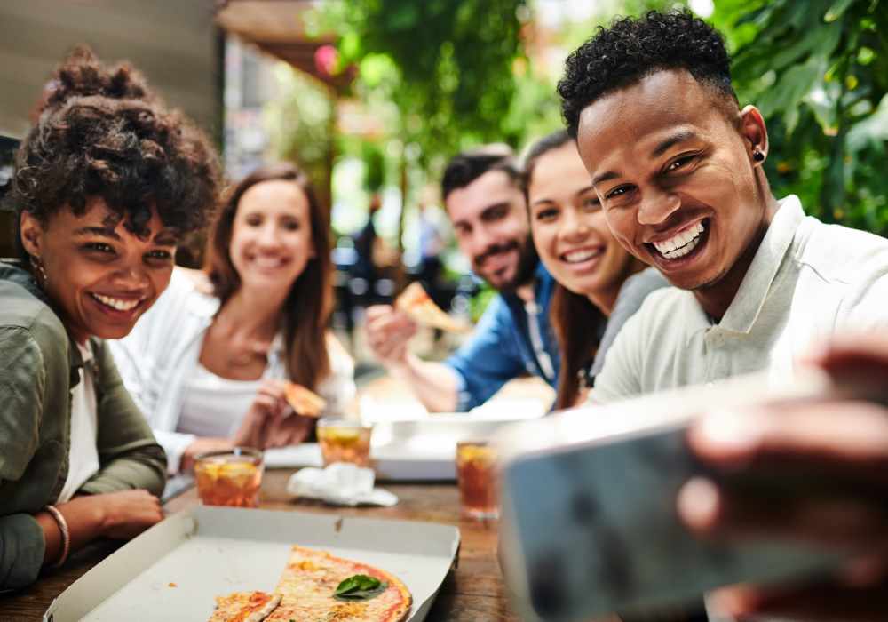 A group of residents taking a selfie near Mission University Pines in Durham, North Carolina