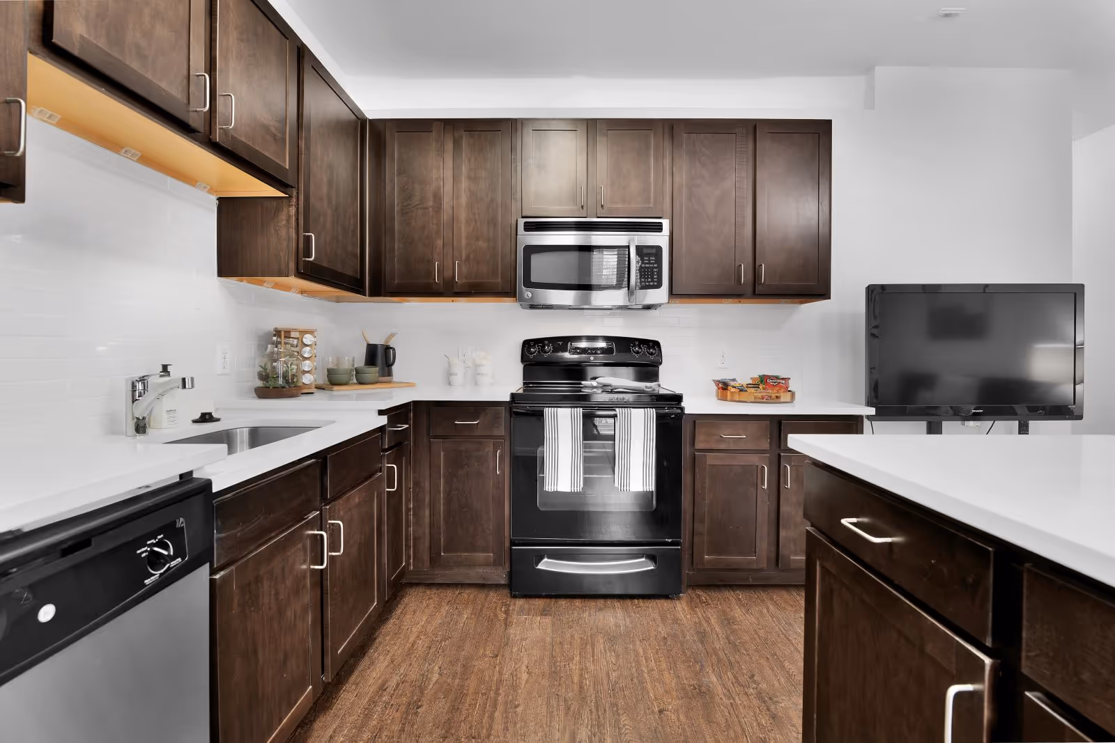 Kitchen with brown cabinets and stainless steel cabinets