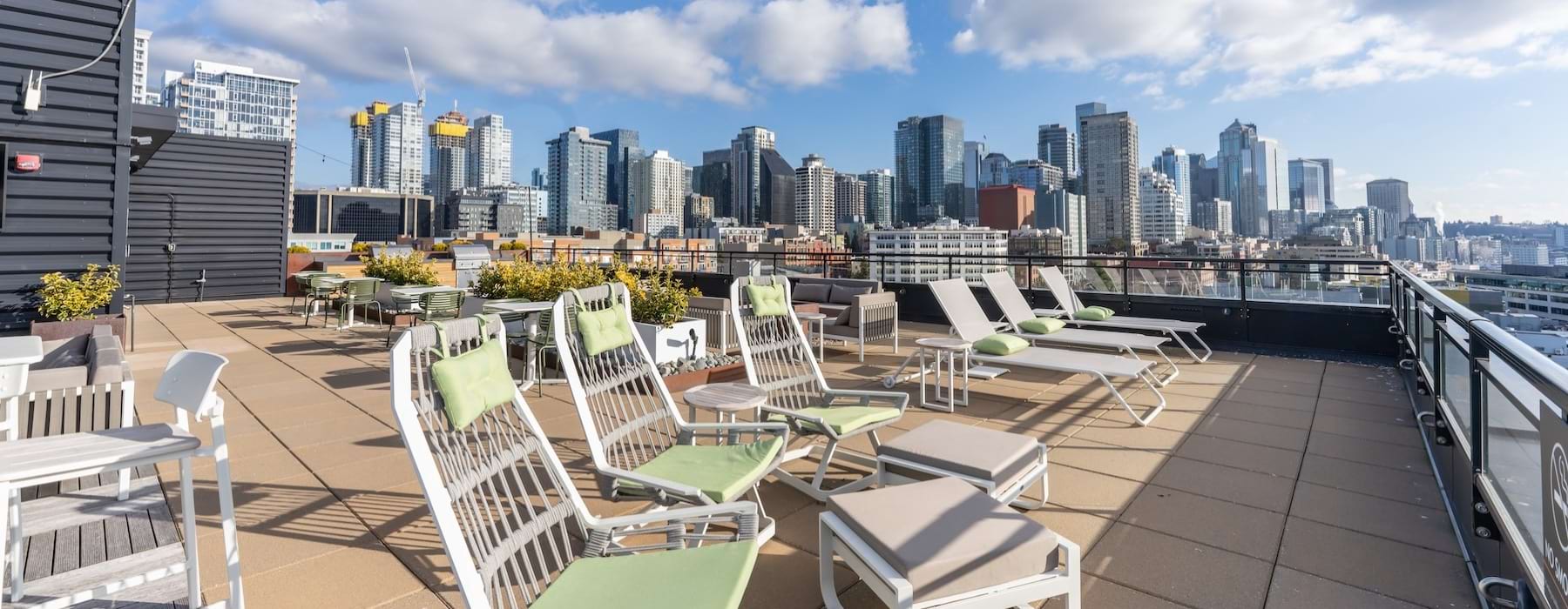 a group of chairs on a deck overlooking a city