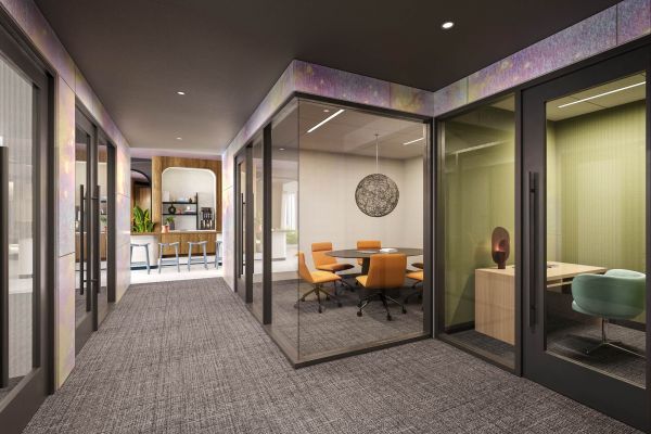 Bright and modern study suite at VERVE Orlando featuring glass-enclosed rooms, ergonomic chairs, and a quiet, professional atmosphere ideal for meetings, study sessions, or remote work. 