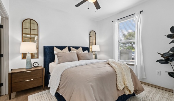 Bedroom with natural lighting and high ceilings