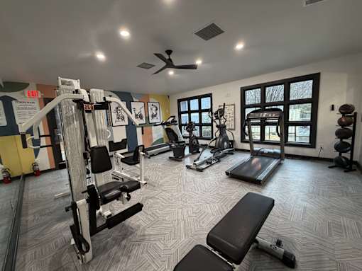 Modern fitness center in Raleigh, NC at Remington Place Apartments with strength training equipment